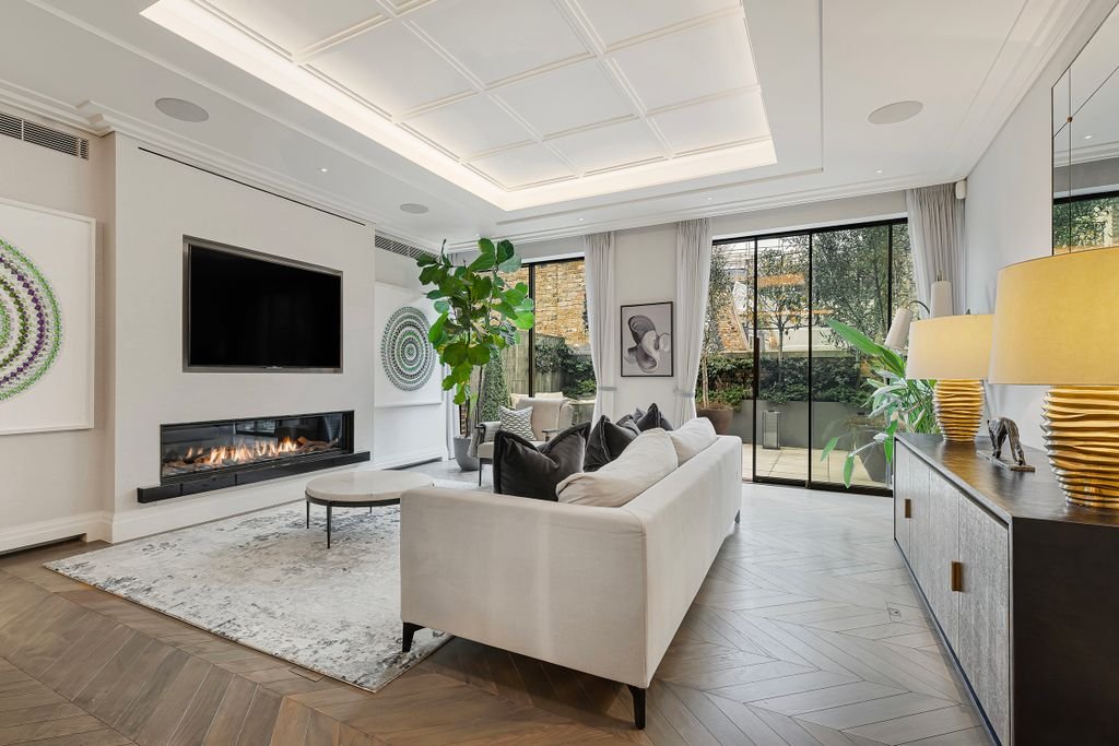 Luxury London smart home — living room with herringbone floors and automated lighting