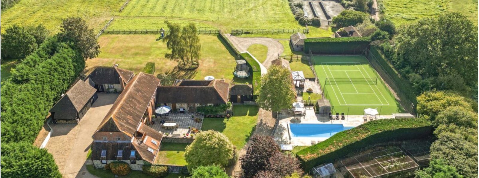 West Sussex Country House — aerial view of barn, pool and tennis court